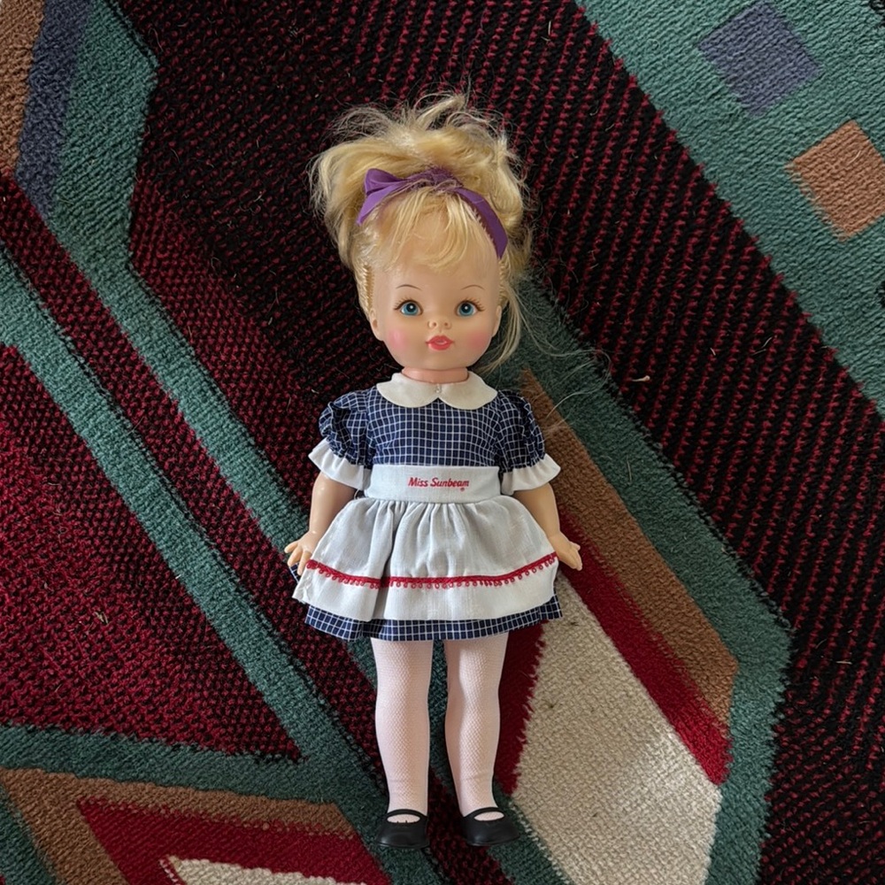 Classic Doll with Blue Dress and Purple Bow